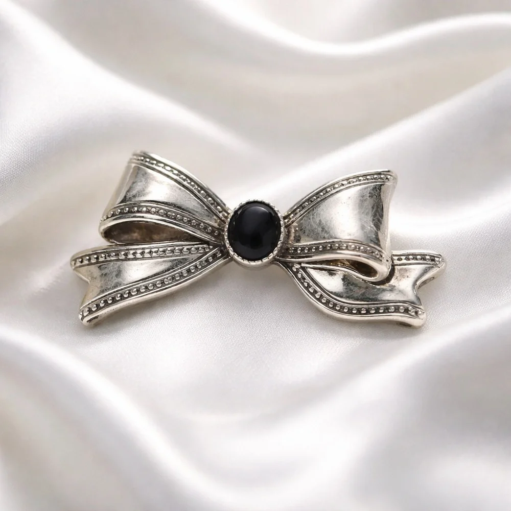 Silver Tone Bow Brooch with Black Center